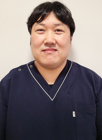 井塚　健造